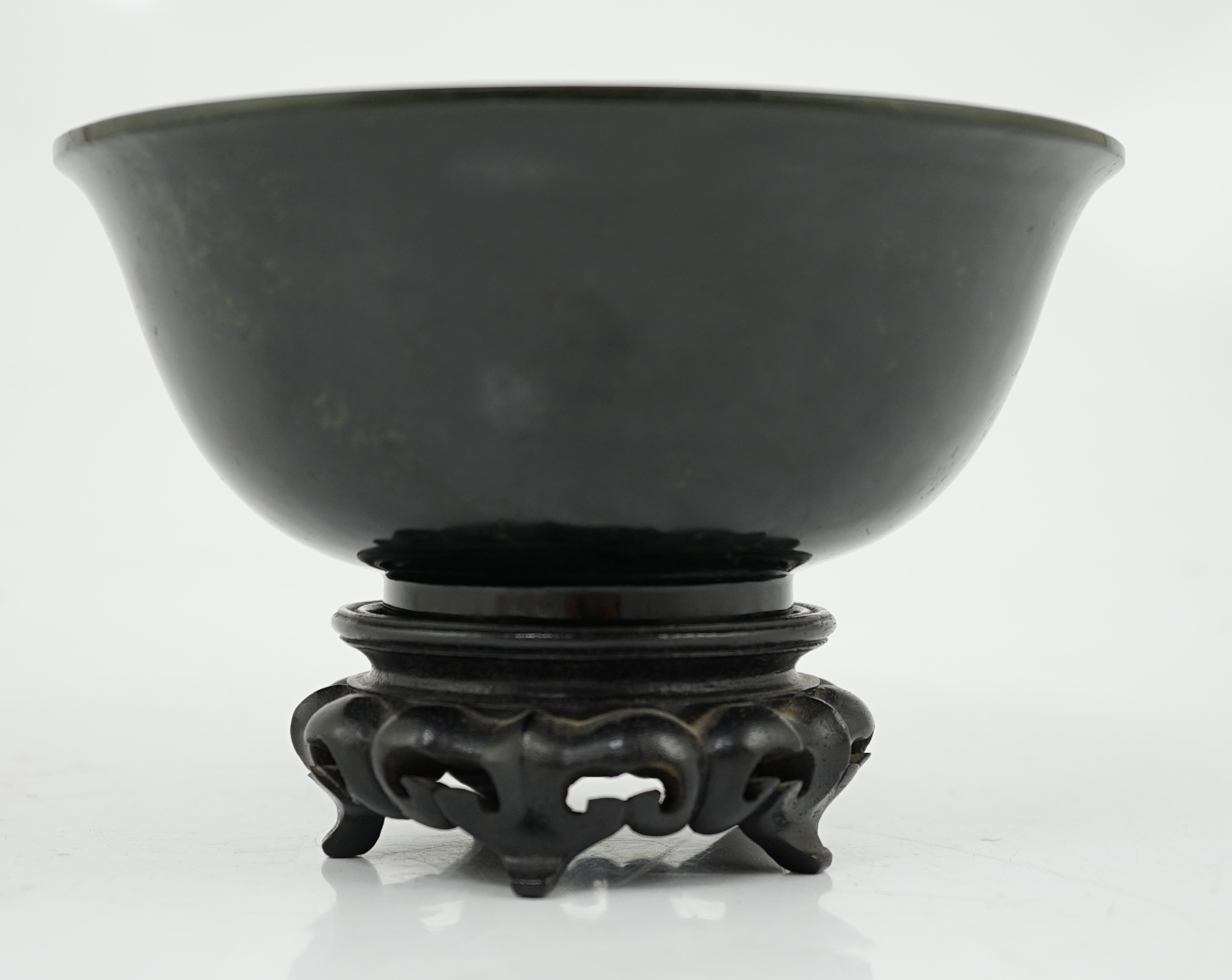 A Chinese dark spinach green jade bowl, engraved Qianlong seal mark but 19th/20th century
